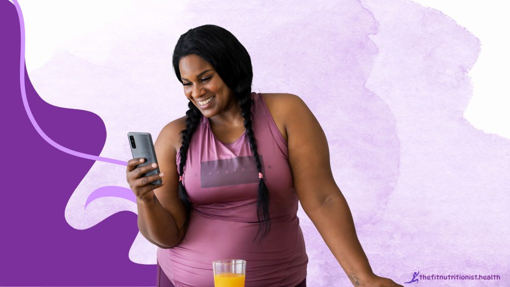 postpartum fitness trainer, image, woman holding a phone and having a cup of juice